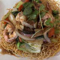 Seafood Bird'S Nest · stir-fried tiger prawns, calamari, mushrooms and garden
vegetables tossed in rice wine and o...