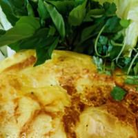 Crispy Vietnamese Crepe · savory crepe stuffed with shrimp, beansprouts, jicama and mushrooms served with fresh lettuc...
