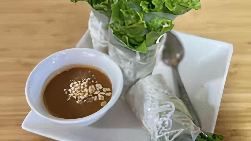 Coconut Summer Rolls · shredded coconut, toasted peanuts, lettuce, sautéed tofu, stir-fried carrots, jicama, basil, crispy rice paper roll wrapped in rice paper and served with a side of homemade peanut sauce.