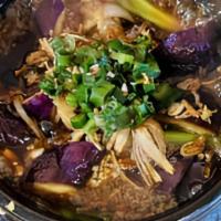 Eggplant Clay Pot · asian eggplant braised in shallot soy sauce, with onion, garlic
and black pepper, served wit...