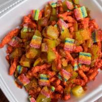 Sour Cheetos · Hot cheetos with pickles, gummy worms, chamoy, chile and lime.