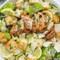 Chicken Caesar Salad · Chopped romaine lettuce, tomato, creamy Caesar dressing, fried croutons, shaved parmesan.