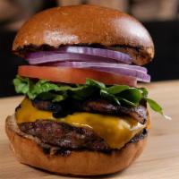 The Classic · Six ounce angus dried aged patty, lettuce, tomato, onion, mayo, ketchup, mustard with a pick...