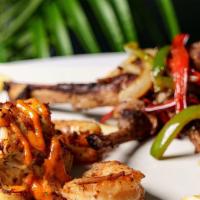 Seafood Trio · Number 1 Seller 3 Grilled Lamb Chops : 6 ounce Lump Crab Cake & 5 Grilled Shrimp with Sautée...