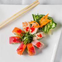 Rainbow Roll · Avocado and cucumber roll top with tuna, salmon, yellowtail shrimp, white tuna.