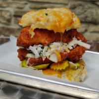 What The Cluck · Crispy chicken breast, hot honey que, soul slaw, b&b pickles, on a jalapeno cheddar cheese b...