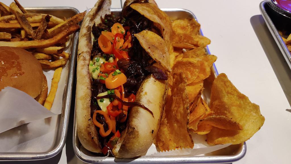 Fun Do Philly Cheesesteak · Thinly sliced rib eye steak, fondue cheese, wit' caramelized onions, house cured sweet peppers on an amoroso roll. 
Chicken cheesesteak also available