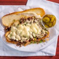 Philly Cheese Steak Sub · Shaved steak with grilled onions, green peppers, mushrooms with Swiss cheese, mayo.