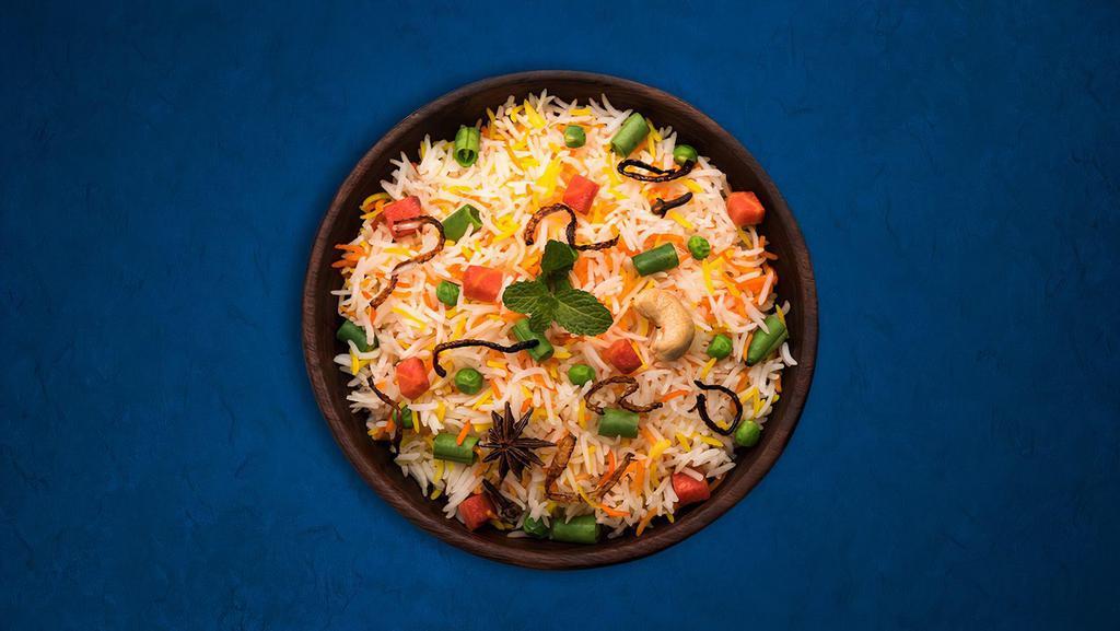 Veggie Biryani(Vegan) · Basmati rice cooked with fresh mixed vegetables cumin seeds, curry leaves, mustard seeds, and exotic herbs. Served with raita.