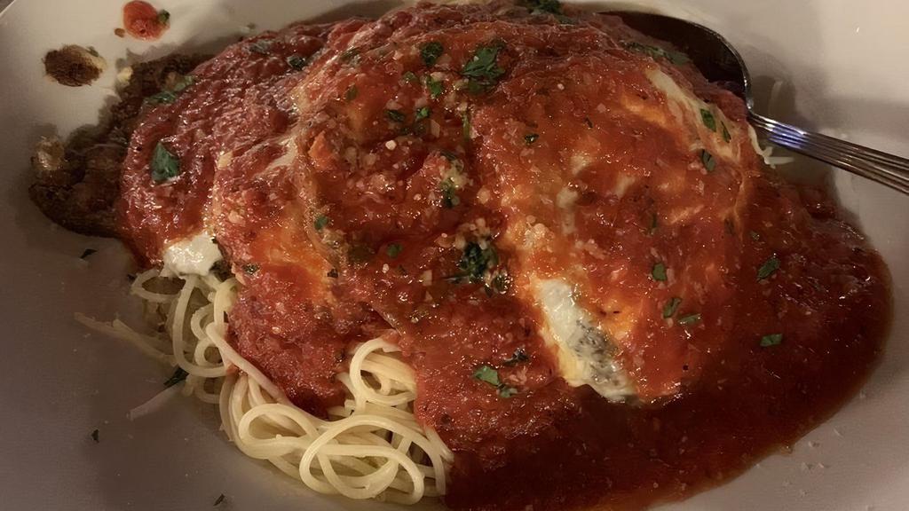 Eggplant Parmesan · Served with angel hair pasta.