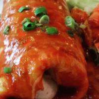 Enmoladas De Pollo / Chicken Enmoladas · Tres enchiladas de pollo cubiertas con nuestra sabrosa salsa de mole mexicano. / Three chick...