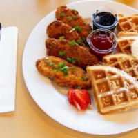 Chicken & Waffle · A fresh made malted Belgian waffle paired with our hot, crispy chicken tenders dusted with p...