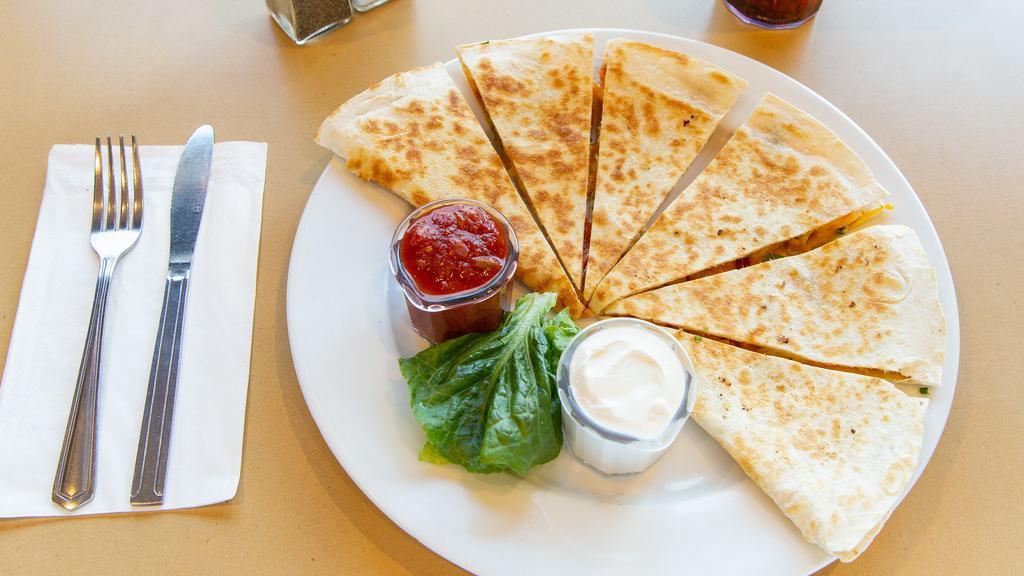 Chicken Quesadilla · A warm white or wheat tortilla filled with juicy chicken, melted cheese, crisp bacon, scallions and tomato. Served with salsa and sour cream.