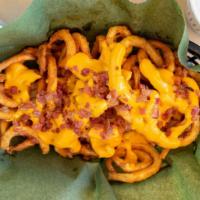 Loaded Curly Fries · Our secretly Seasoned French Fries covered in melted cheese and bacon bits. Mouth waveringly...