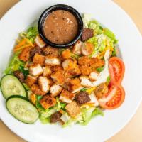 Crispy Chicken Salad · A fresh mix of lettuce, tomato, two-cheese blend, cucumbers, carrots, crunchy croutons and f...