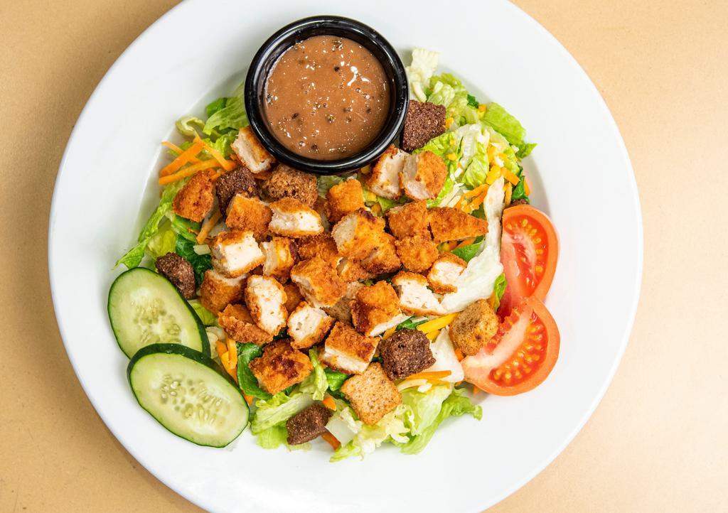 Crispy Chicken Salad · A fresh mix of lettuce, tomato, two-cheese blend, cucumbers, carrots, crunchy croutons and fried crispy chicken. Served with your choice of dressing.