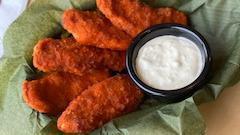 Buffalo Chicken Tenders · Premium chicken tenders, battered and fried to a delicious golden hue tossed in Buffalo sauc...