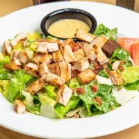 Ceaser Grilled Chicken Salad · Crisp romaine, tossed in our Caeser dressing with croutons. tomato, grilled chicken, shredde...