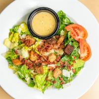 Ceasar Empire Salad  · Crisp romaine, tossed in our Caesar dressing with croutons, tomato, shredded parmesan cheese...