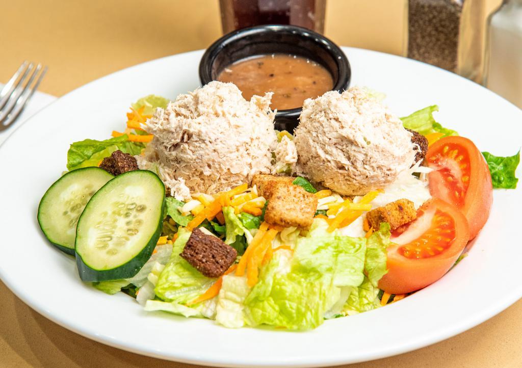 Tuna Garden Salad · A fresh mix of lettuce, tomato, two-cheese blend cucumbers, carrots and crunchy croutons topped with Tuna Salad. Served with your choice of dressing.