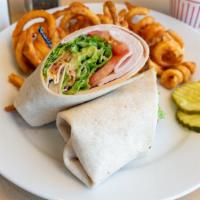 Turkey Avocado Wrap · Sliced turkey, bacon, lettuce, tomato, avocado slices and secret sauce all rolled up in on o...