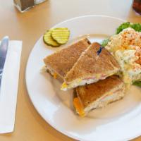 Tuna & Cheddar Mega Melt · Newport Creamery’s own tuna salad, topped with cheddar cheese and tomato on grilled rye brea...