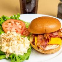 Bbq Bacon And Cheddar Sandwich · Grilled chicken topped with cheddar cheese, bacon and bbq sauce. Served with crisp lettuce a...