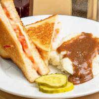 Grilled Cheese And Tomato Sandwich · A classic grilled cheese with American Cheese and fresh sliced tomato on white bread grilled...