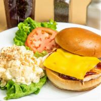 Bbq And Cheddar Chicken Sandwich · An old fashioned favorite with BBQ sauce and cheddar cheese. Served with crisp lettuce, toma...