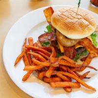 Western Bacon Burger · A big beef topped with bacon, cheddar cheese, and BBQ sauce, onion rings, lettuce and tomato...