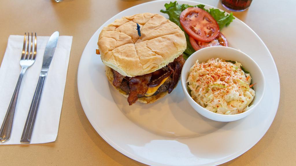 Big Beef Smokey Mountain Burger · Cheddar cheese, bacon, onions, and BBQ sauce on our Big Beef burger. Served on grilled bread with crisp lettuce & tomato on the side.