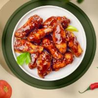 Better With Bbq Wings  · Fresh chicken wings fried and tossed in classic BBQ sauce. Served with your choice of dippin...