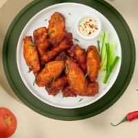 Ranch Baby Wings · Fresh chicken wings fried and tossed in classic ranch sauce. Served with your choice of dipp...