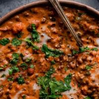 Dal Makhani · Vegetarian. Black lentils and kidney beans cooked in a tomato sauce with ginger, garlic and ...