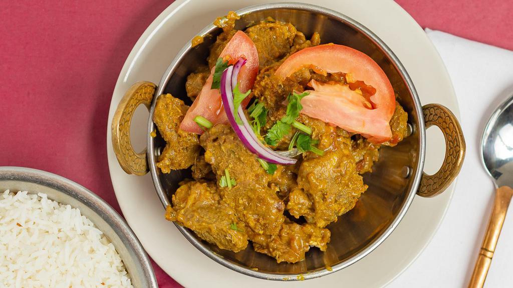 Lamb Curry · Lamb cubes cooked in onion and tomato sauce with delicious curry spices.