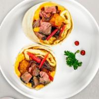Proper Pastrami Breakfast Burrito · Pastrami, eggs, cheddar cheese, tomatoes and onions wrapped in a flour tortilla.