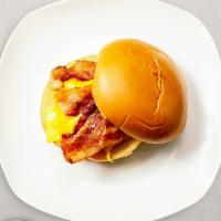 Bacon, Egg, & Cheese Sandwich · Scrambled egg, bacon, and cheddar cheese served on a bread.