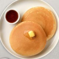 Let Them Eat Pancakes · Three fluffy house pancakes cooked with care and love.