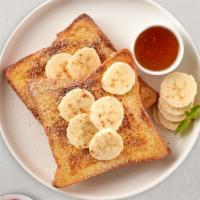 Banana French Toast · Fresh bread battered in egg, milk, and cinnamon cooked until spongy and golden brown. Topped...