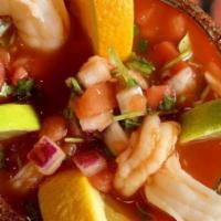 Coctel De Camaron · Prepared with shrimp, cilantro, orange, citrus, bits of avocado, tomato, and clam juice; ser...