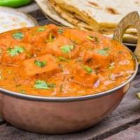 Paneer Tikka Masala · Cottage cheese cooked in creamy and tomato gravy with a combination of onion, peppers, and t...