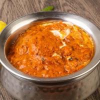 Butter Chicken · Clay oven baked chicken cooked in rich tomato butter cream cheese.