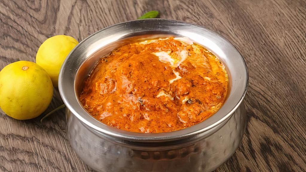 Butter Chicken · Clay oven baked chicken cooked in rich tomato butter cream cheese.