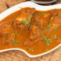 Andhra Fish Curry · Boneless fish cooked in traditional Andhra tangy style with homemade spices.