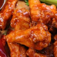 15 Wingers (1 Dip) · Fresh jumbo wings covered with your choice of our wings sauce. Served with Bleu cheese or ra...