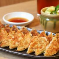 Gyoza (6) · Pan fried or steamed chicken and pork dumpling