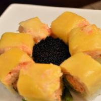 Golden Dragon Roll · salmono avocado,crunch roll,topped w.lobster salad,mango ,caviar mango sauce