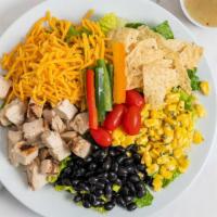 Southwestern Chicken Salad · Romaine lettuce, grilled chicken, shredded cheddar cheese, tomatoes, corn, black beans, tort...