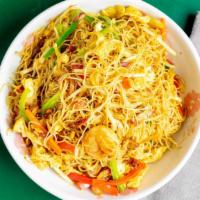 Singapore Rice Noodles · Spicy. pork, shrimp, eggs, and rice vermicelli in a Curry sauce.
