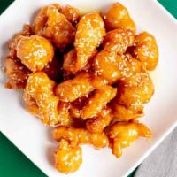 Sesame Chicken · Deep-fried chicken in a special sauce sprinkled with sesame seeds.
